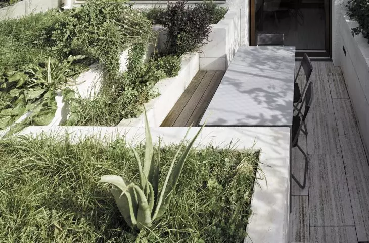 garden terrace in the ground floor at the level of the kitchen and dining room