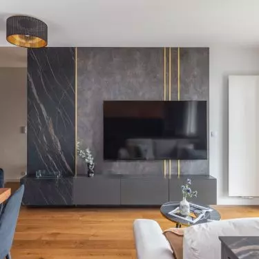 The wall with the TV was finished with marble