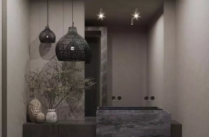 The bathroom is kept in dark colors
