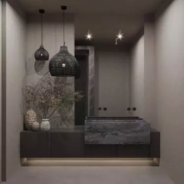 The bathroom is kept in dark colors