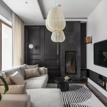 The living room uses a classic combination of black and white