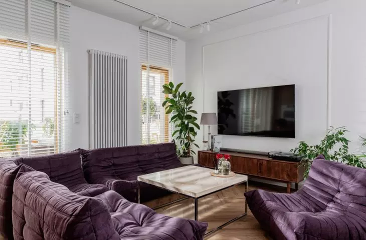 The lounge area features iconic sofas and armchairs designed by Michel Ducaroy 