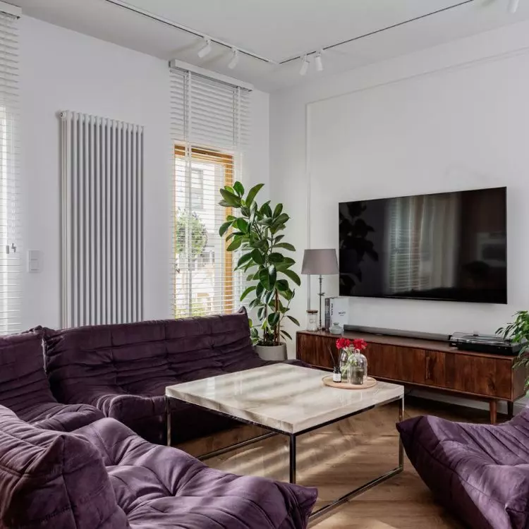 The lounge area features iconic sofas and armchairs designed by Michel Ducaroy 