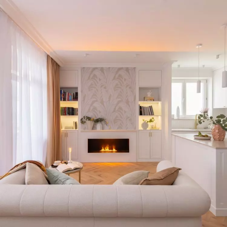 The wall above the electric fireplace was decorated with wallpaper