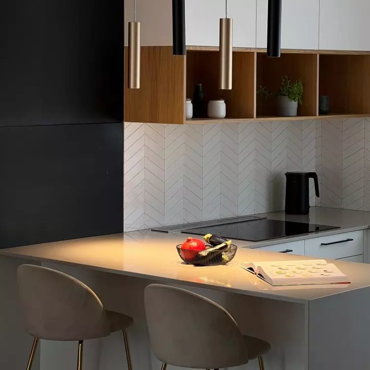 The wall was covered with glazed tiles arranged in a herringbone pattern