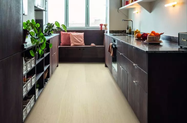 You don't have to replace the entire floor. All you need to do is lay laminate on top of the existing surface 