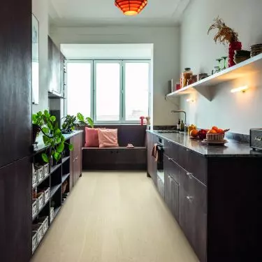 You don't have to replace the entire floor. All you need to do is lay laminate on top of the existing surface 