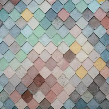 The asphalt shingles are covered with mineral sprinkles, which are responsible for their rich color palette
