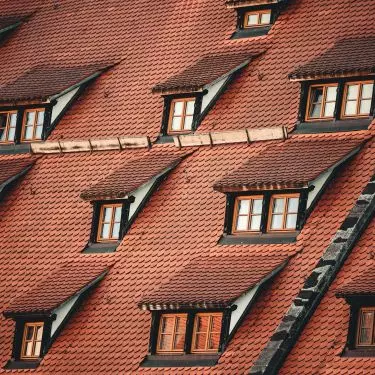 Shingles are durable and striking roofing materials. Their color and form can imitate ceramic tiles or wood