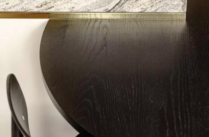 detail of the connection between the kitchen island and the table