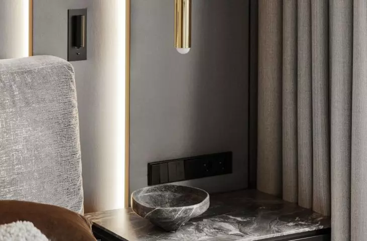 Bedside tables have stone tops