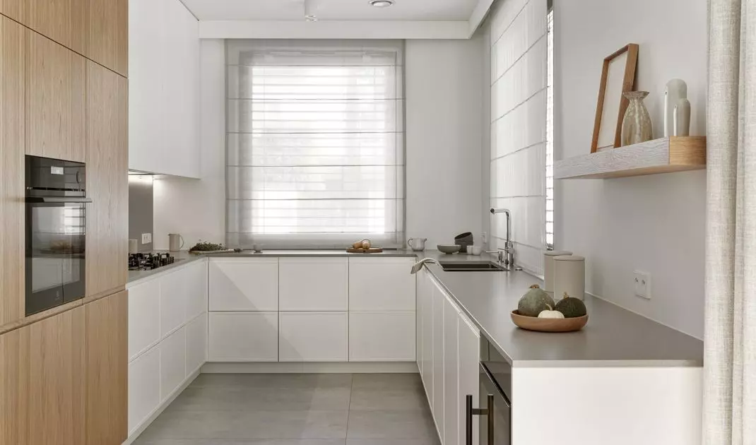 The kitchen cabinet is U-shaped