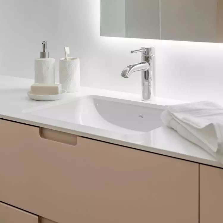 The first floor bathroom has two washbasins