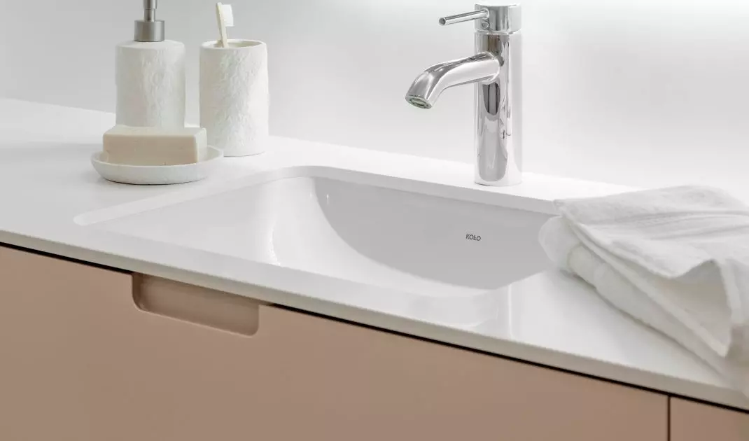 The first floor bathroom has two washbasins