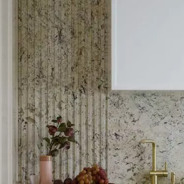 Walls and countertops are covered with natural stone