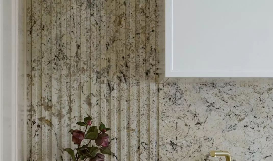 Walls and countertops are covered with natural stone