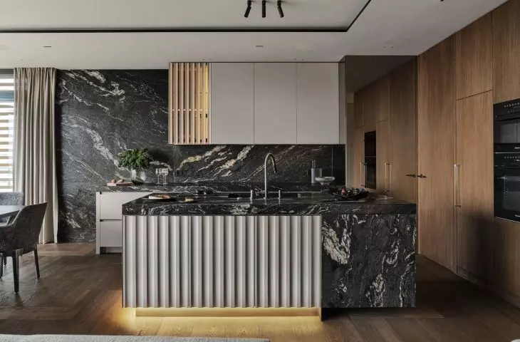 Brushed granite has been juxtaposed with smooth built-ins