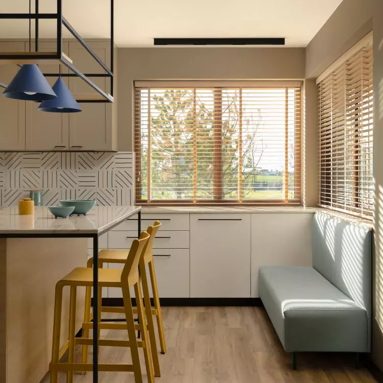 The investor wanted an upholstered bench in the kitchen