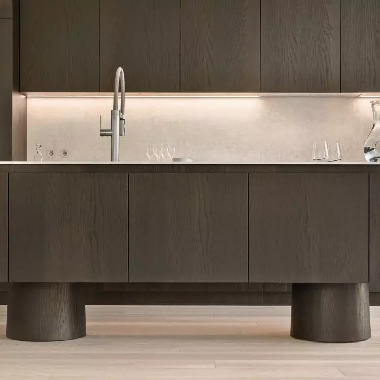 The open kitchen is located next to the living room