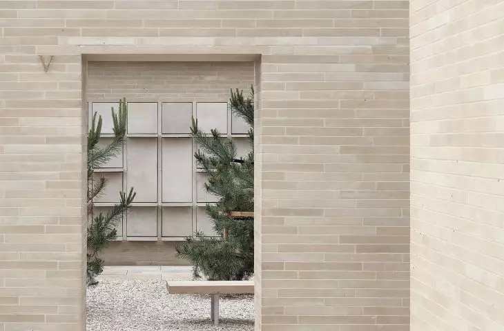 in a monochromatic space, the architects used diverse forms and textures of materials
