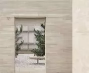 in a monochromatic space, the architects used diverse forms and textures of materials