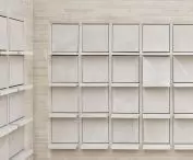shelves and arrays with hidden fasteners that allow niches to open and close are made of sandstone