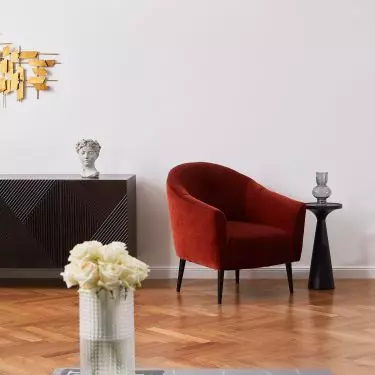 Red armchair will add character to the interior