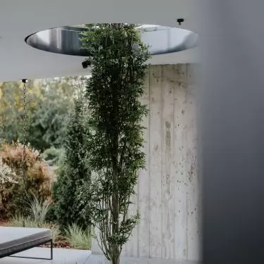 The openings in the ceiling slab are inspired by the designs of Japanese architect Tadao Andō