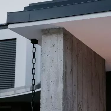 Reinforced concrete walls stood on two sides of the house
