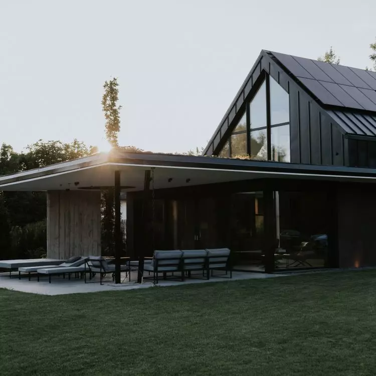 The design uses a lot of glass, concrete and stone