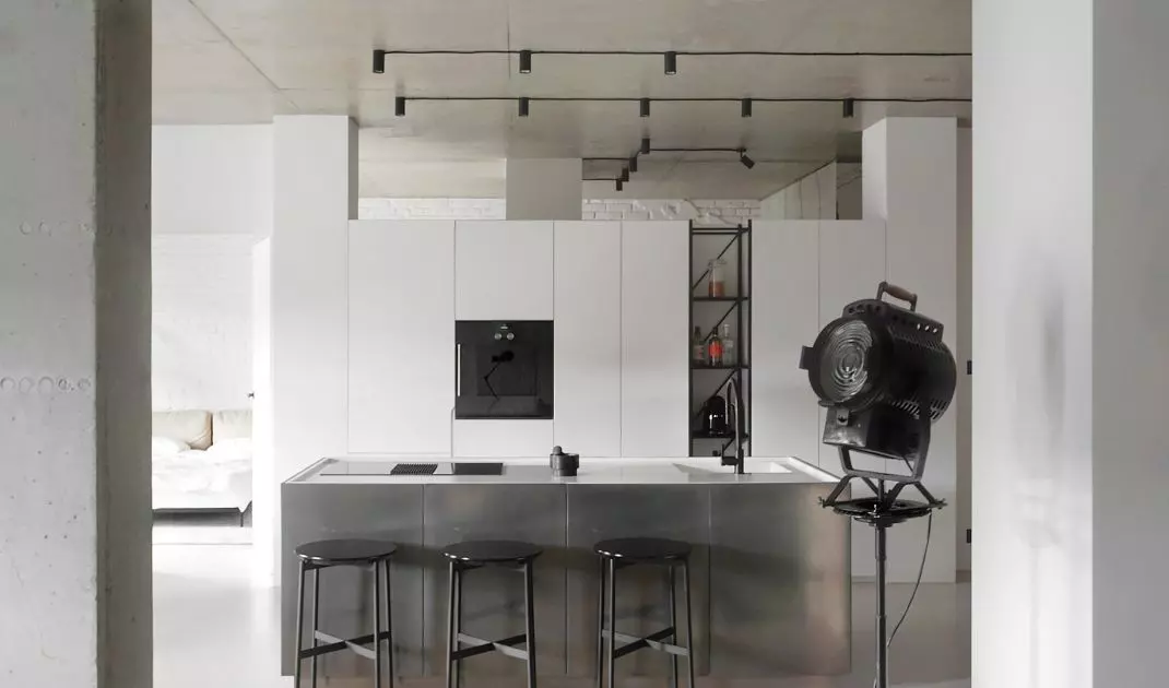 Black fixtures highlight minimalist kitchen design