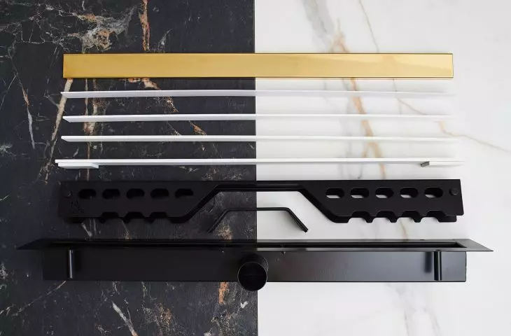 Unfolded CED'OR LINE PRO linear drain with grille in Shiny Natural Gold