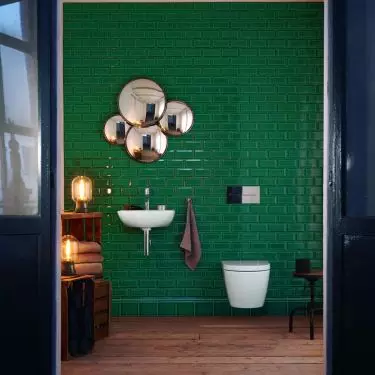 Tiles: Tiles are a functional and aesthetically pleasing way to bring green into a bathroom. For example, emerald green tiles paired with a white ME by Starck sink by Duravit create a luxurious and stylish atmosphere