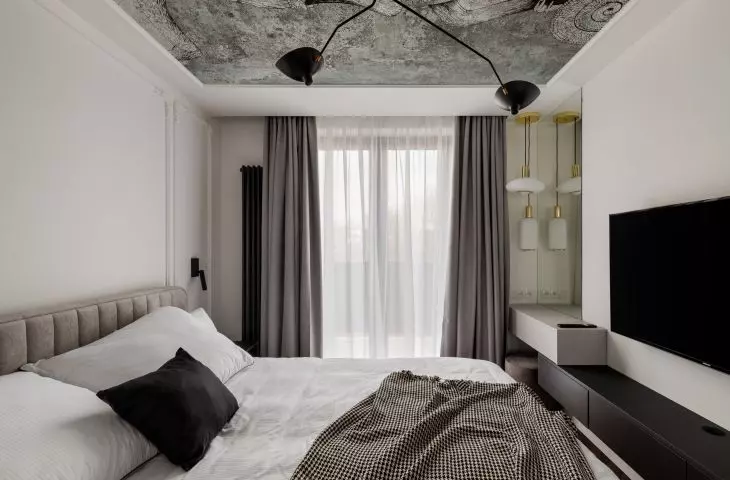 The bedroom decor is subdued