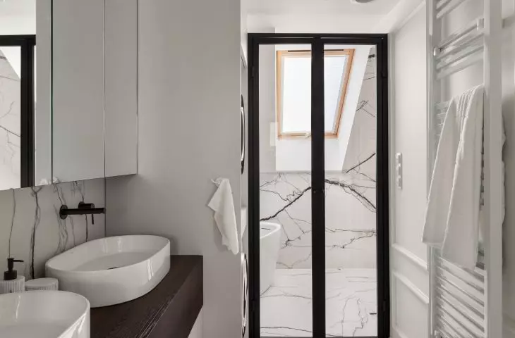 Behind the glass door is a shower