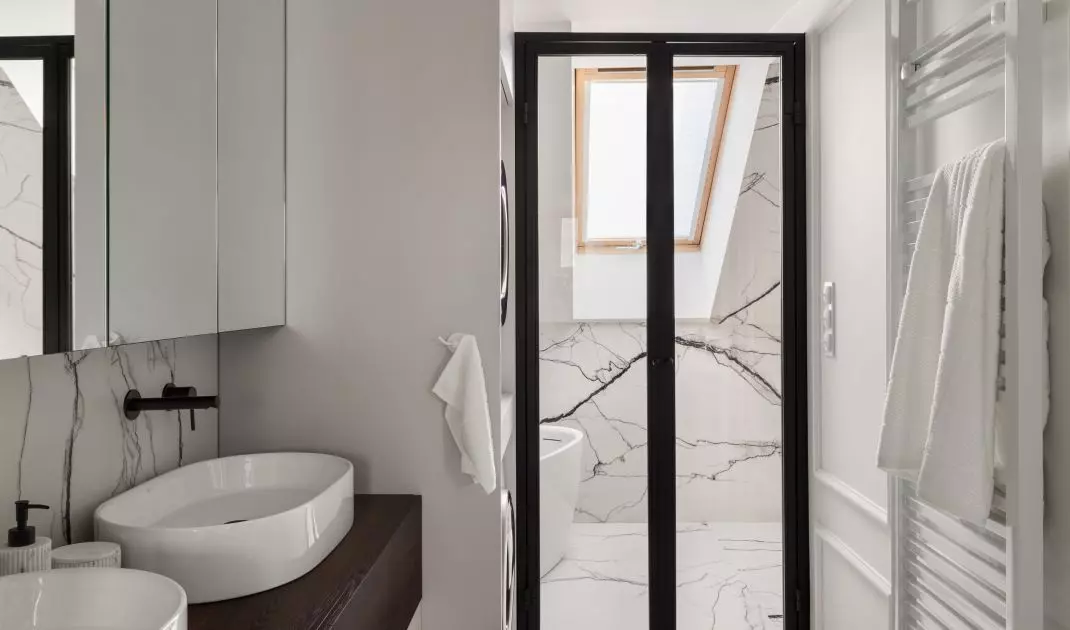 Behind the glass door is a shower