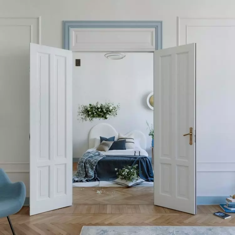 A tall double-sided door leads to the bedroom