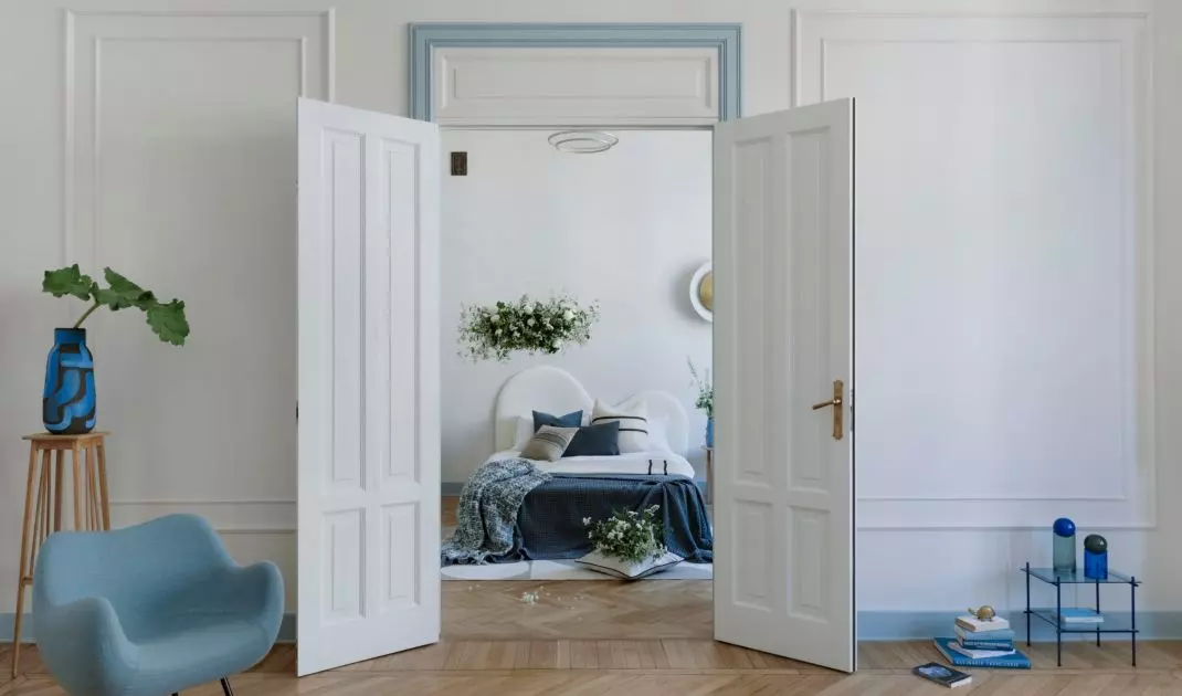 A tall double-sided door leads to the bedroom