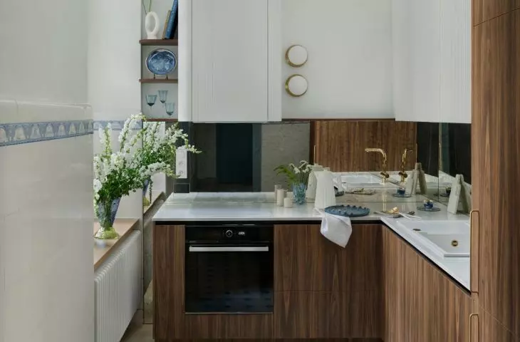 Furniture contrasts with bright tiles