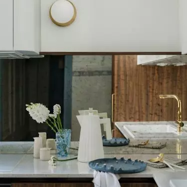 The kitchen furniture was made of dark veneer