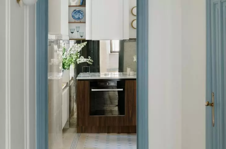 A small hallway has been separated from the kitchen