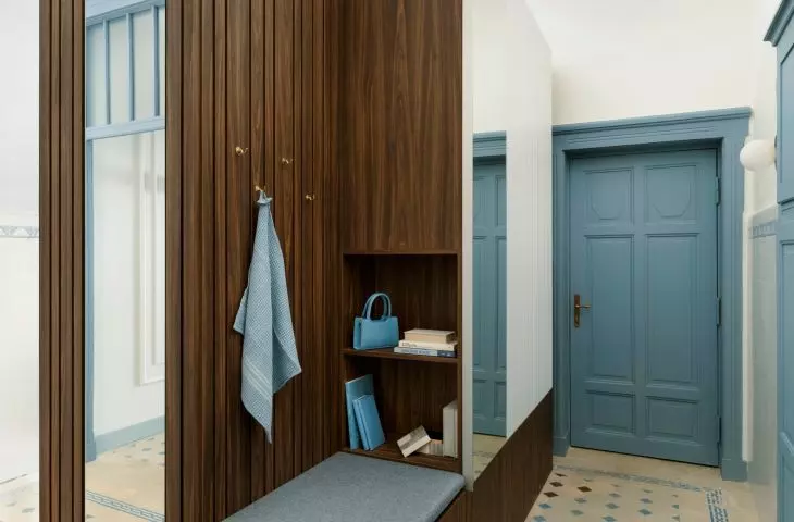 The hallway retains the original kitchen tiles