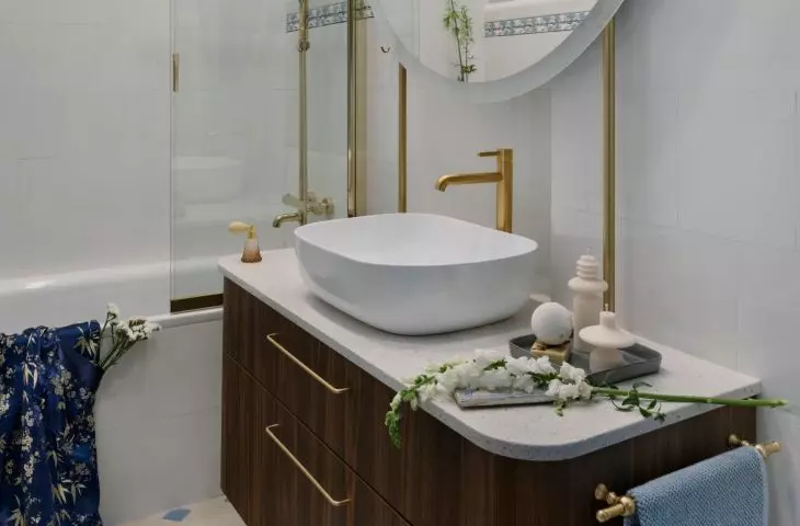 The bathroom is located at the end of a long corridor
