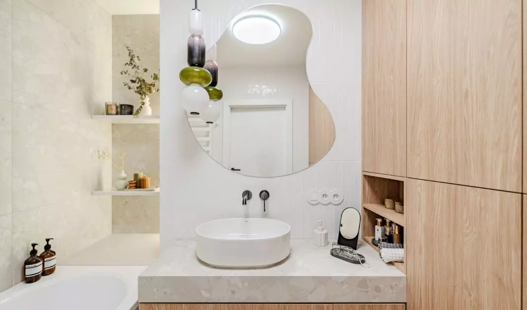Natural wood shades give bathroom a cozy feel