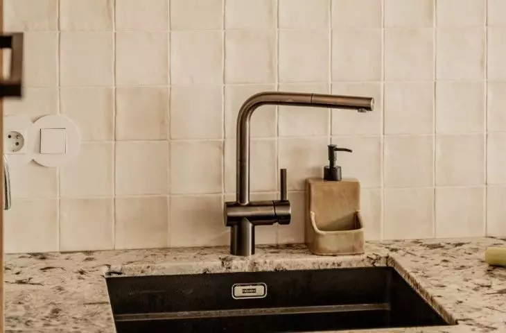 The space above the countertop was covered with zellige type tiles