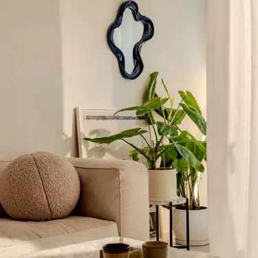 Decorative mirror is a gift from friends at Deer Design studio