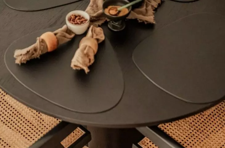 The table was placed on a piece of wooden floor in the form of an archway