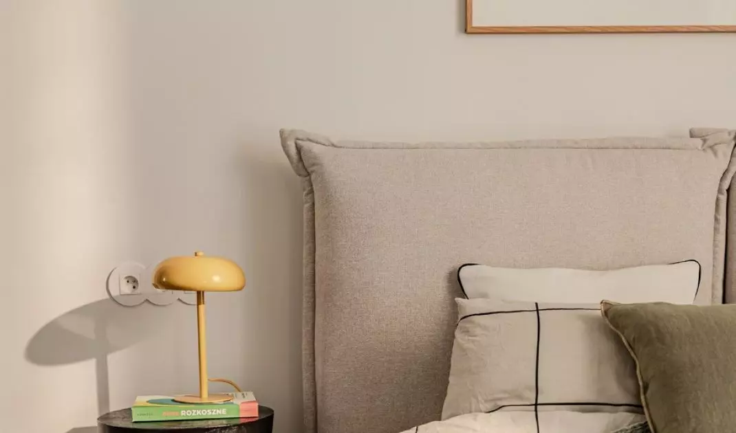 The bed headrest resembles large pillows