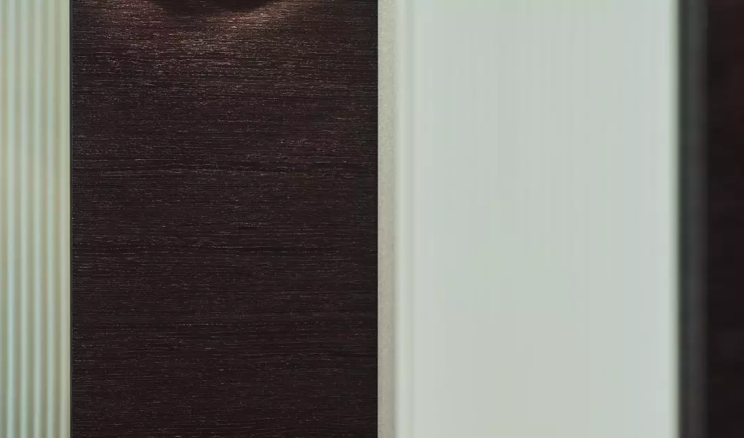Gold wall lamp refers to the shape of a vinyl record player