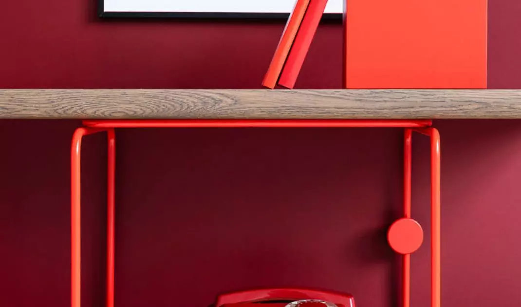 A simple bookcase with metal elements will bring a bauhaus vibe to the interior